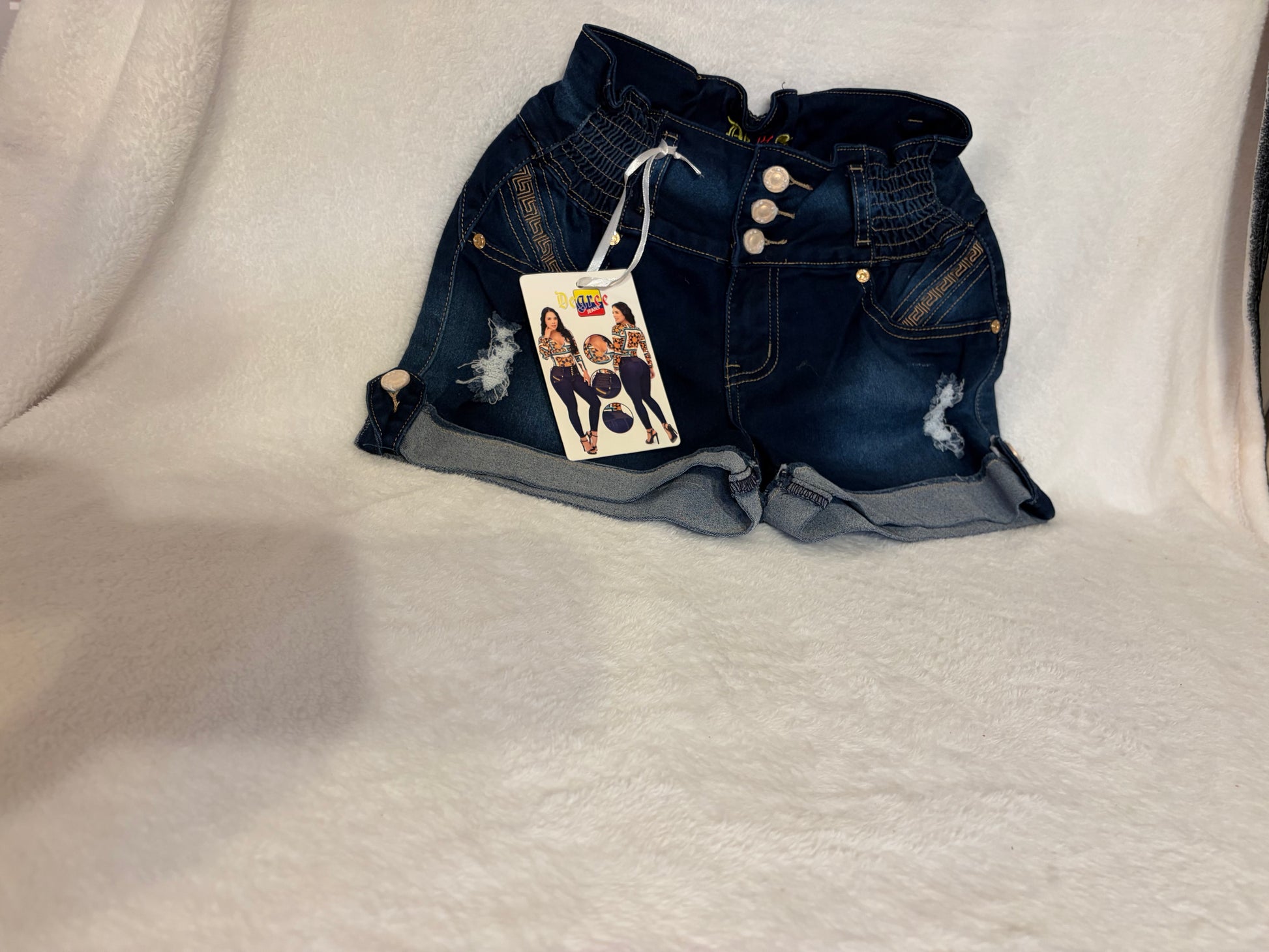 Colombian butt-lifting dark navy denim shorts with brand tag